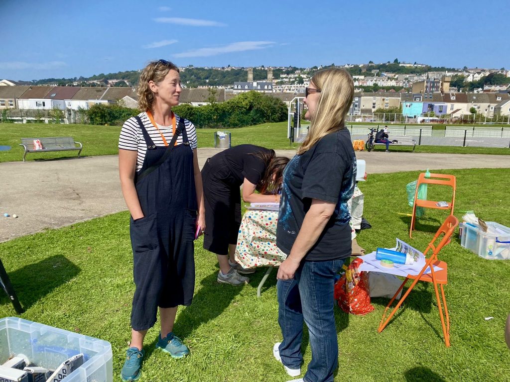 Kate chatting with a member of the community about the project