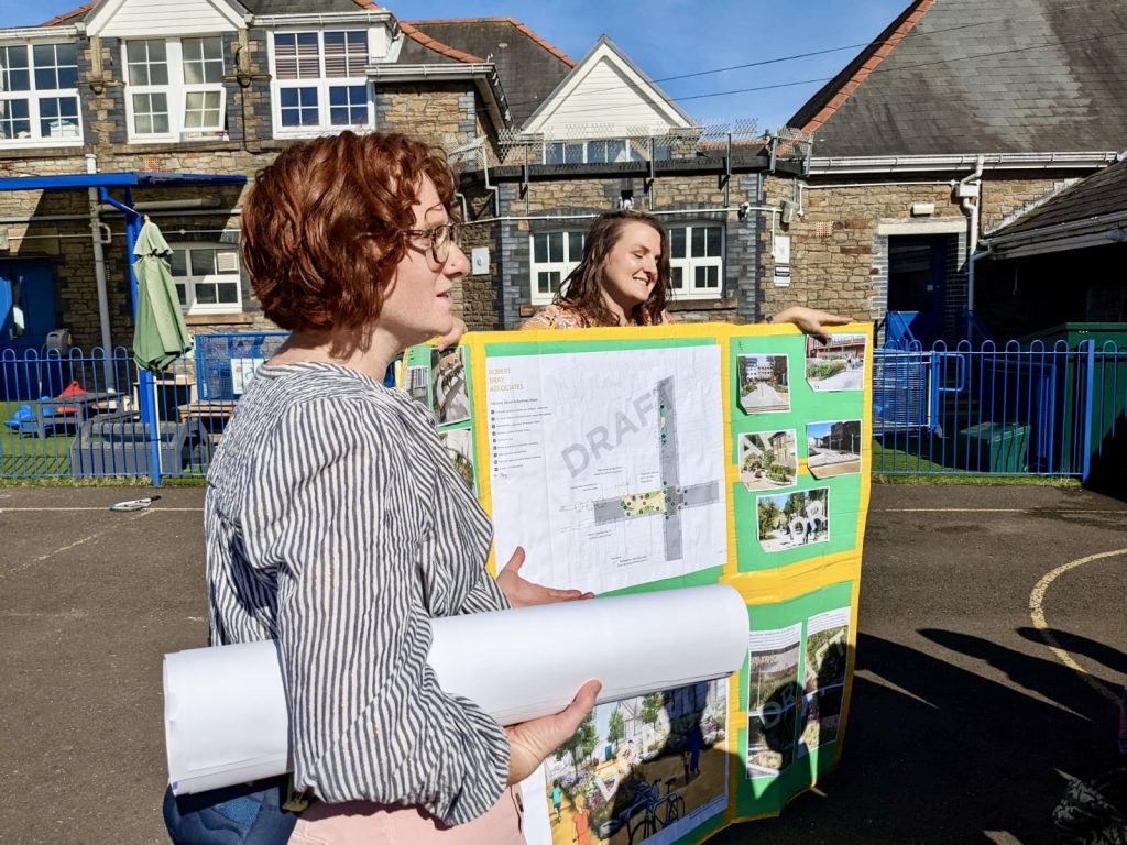 Urban Foundry staff with educational posters