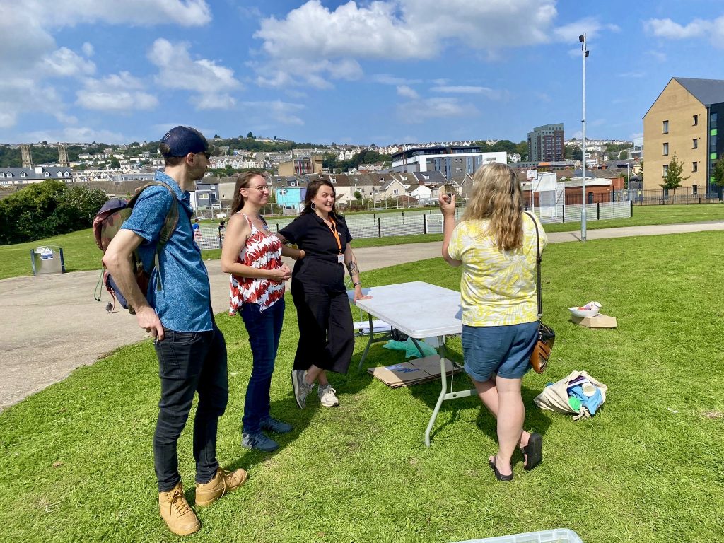 four people discussing the sustainable project